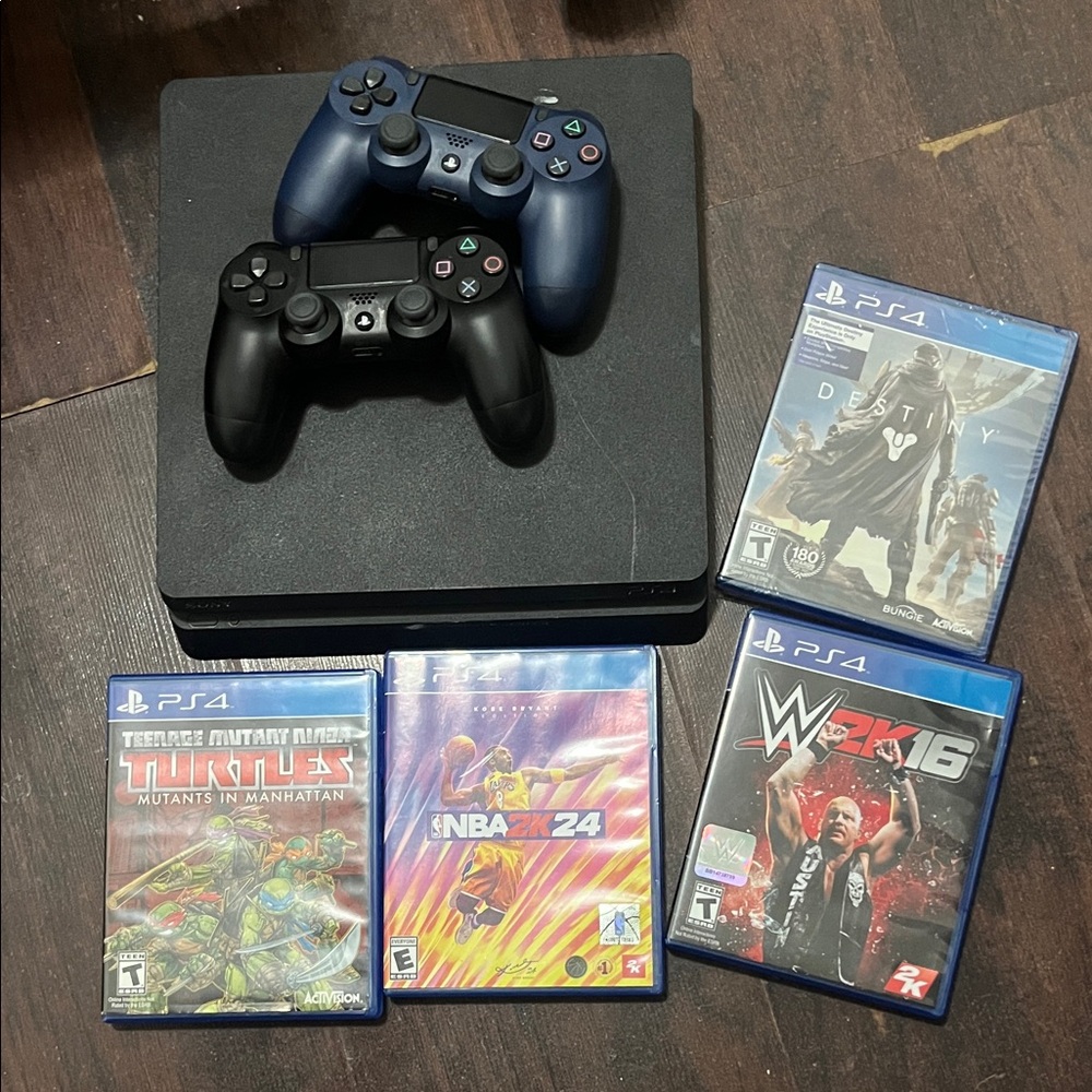 Sony PlayStation Console with Black and Blue controller + ps4 games bundle